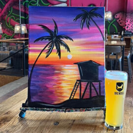 Close-up of painting setup with two drinks, summer edition