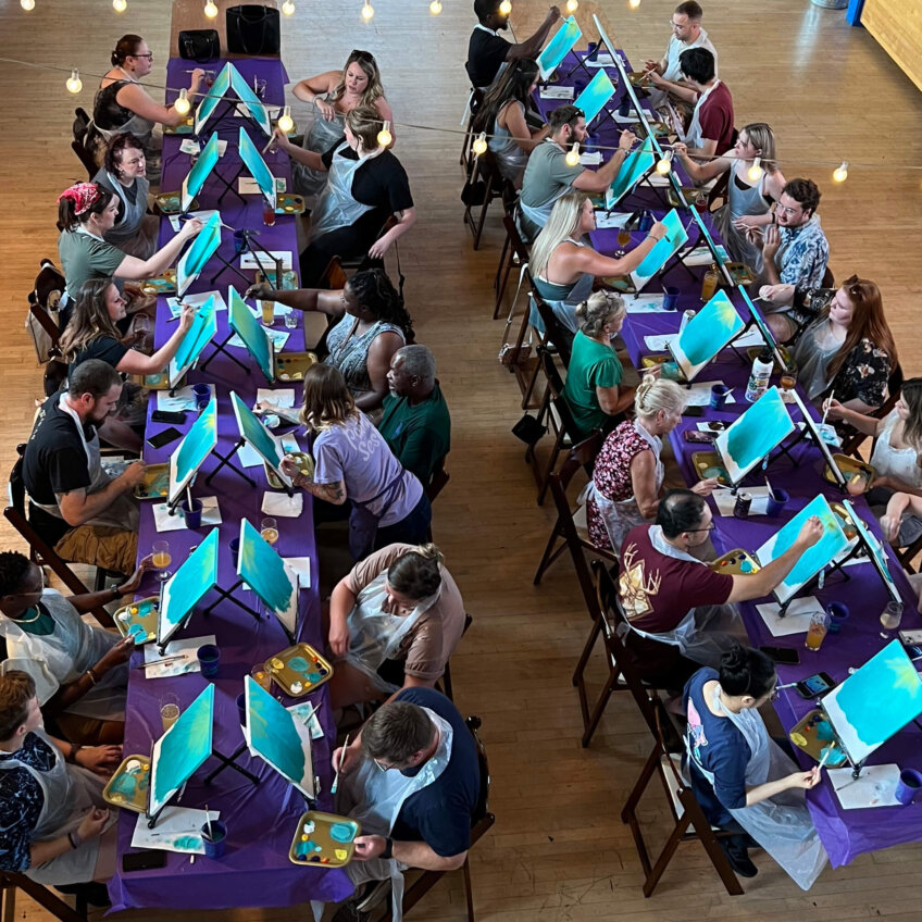 Guests painting and sipping at a Cincinnati art event – what to expect at a paint and sip with The Paint Sesh