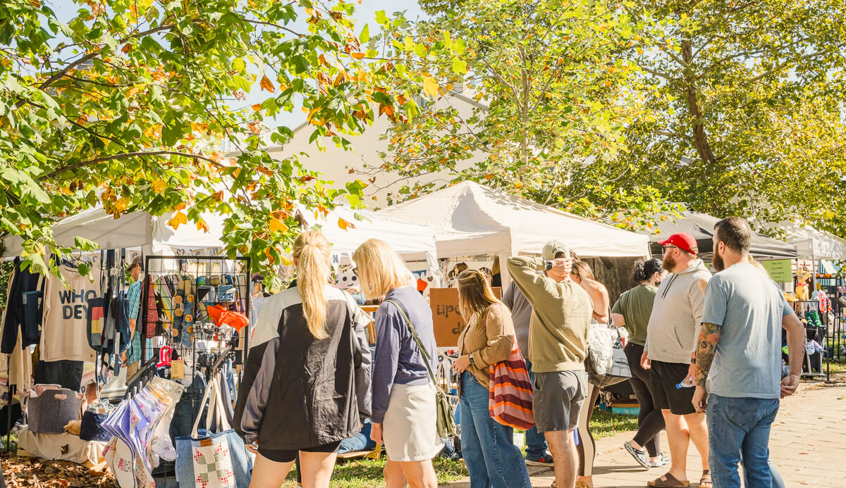 Shoppers browsing local vendors at Fall Cov Craft in Covington, Kentucky