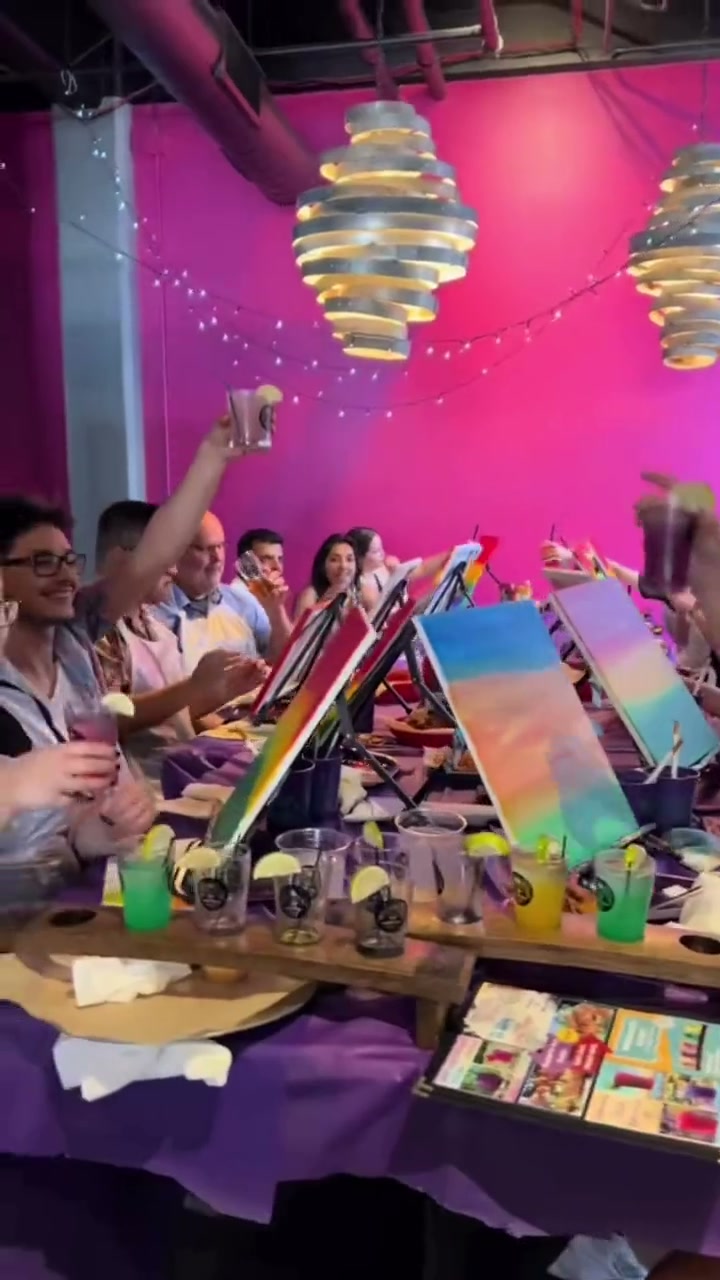 Paint Sesh guests raising a toast at a painting party
